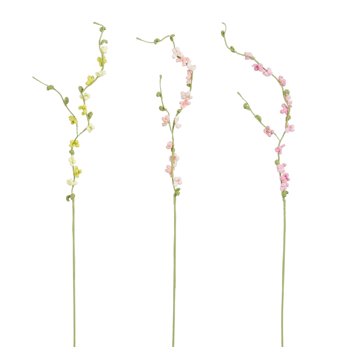 Virkade blomkvistar med små blommor och gröna knoppar i gult, ljusrosa och mörkrosa