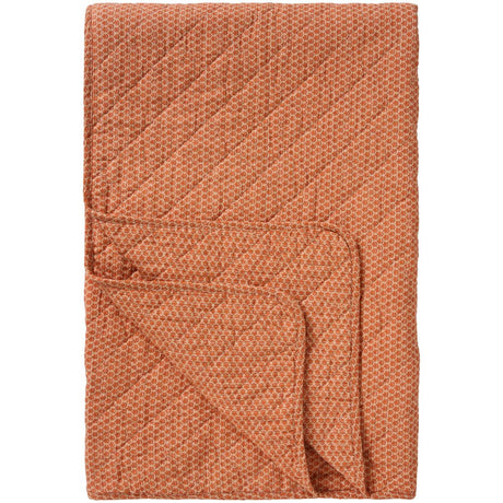Orange quilt från Ib Laursen med diskret quiltat blockmönster och mjuk vadderad yta