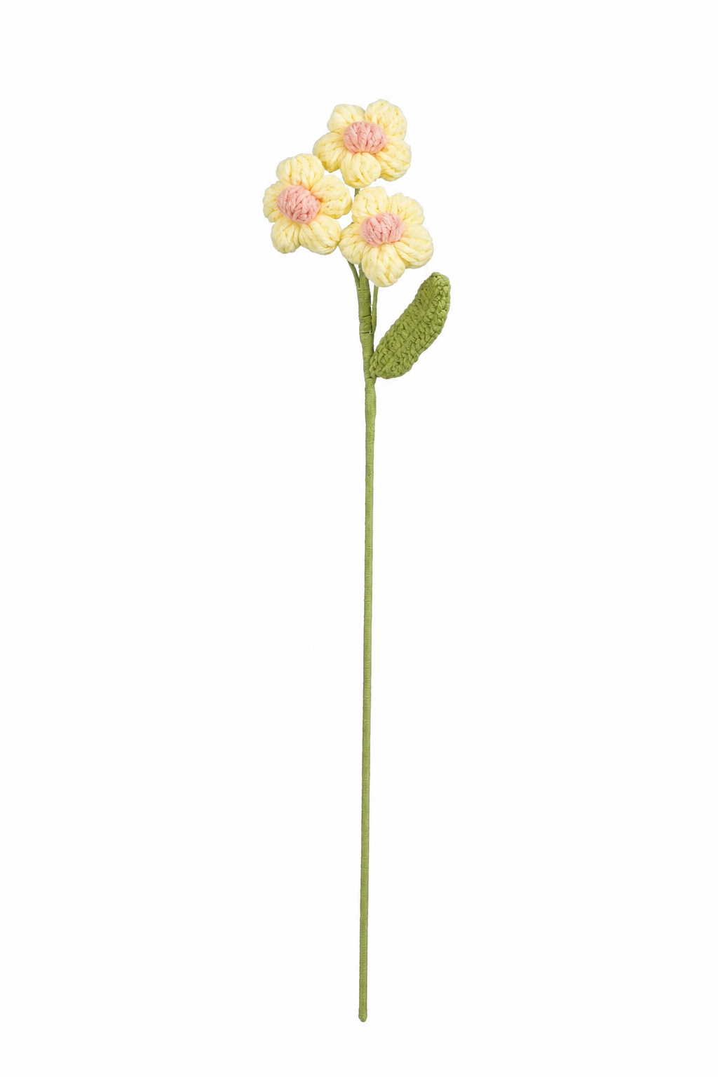 Gul virkad blomsterstjälk med ljusrosa detaljer och små margueritliknande blommor