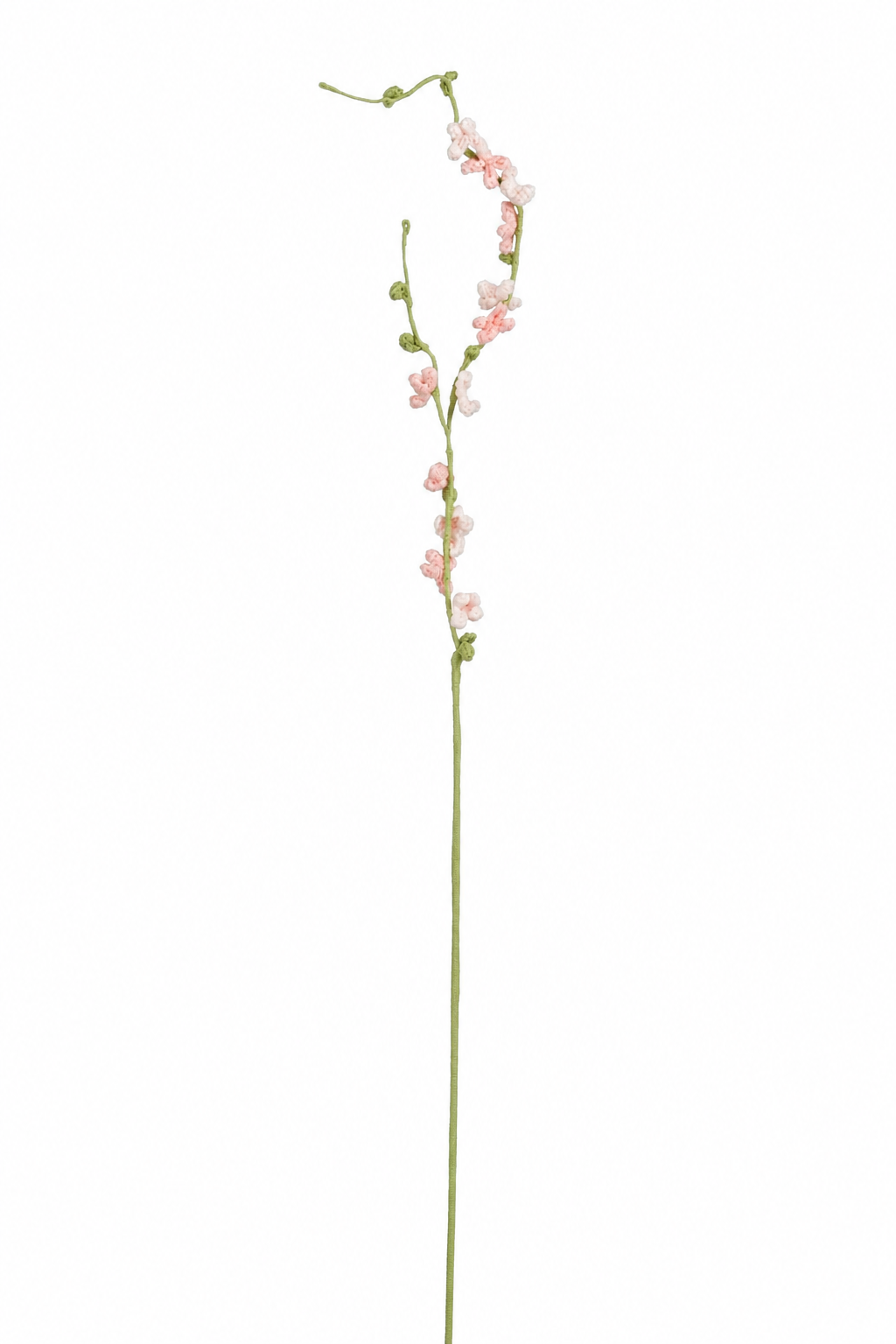 Ljusrosa virkad blomkvist med små blommor för vårbuketter och vaser
