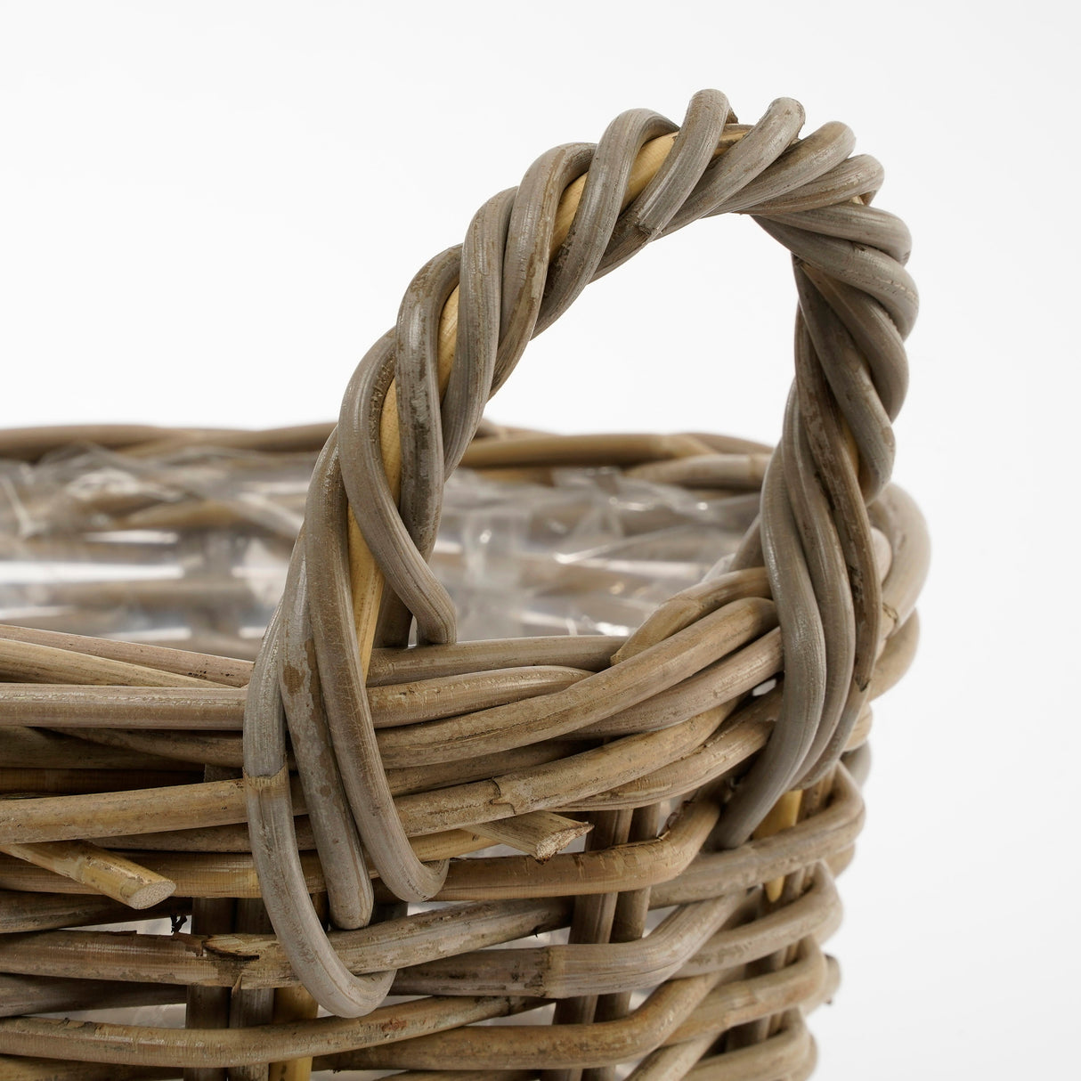 Hanken på Marcia rund kurv med plastinderside i grå rattan