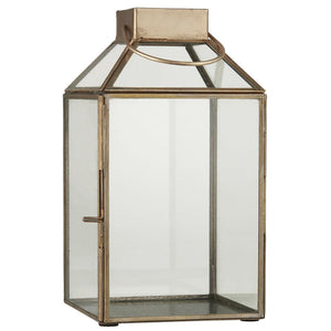 Norr-lykta från Ib Laursen i antik mässingsfärgad metall med klart glas och sned glasstopp